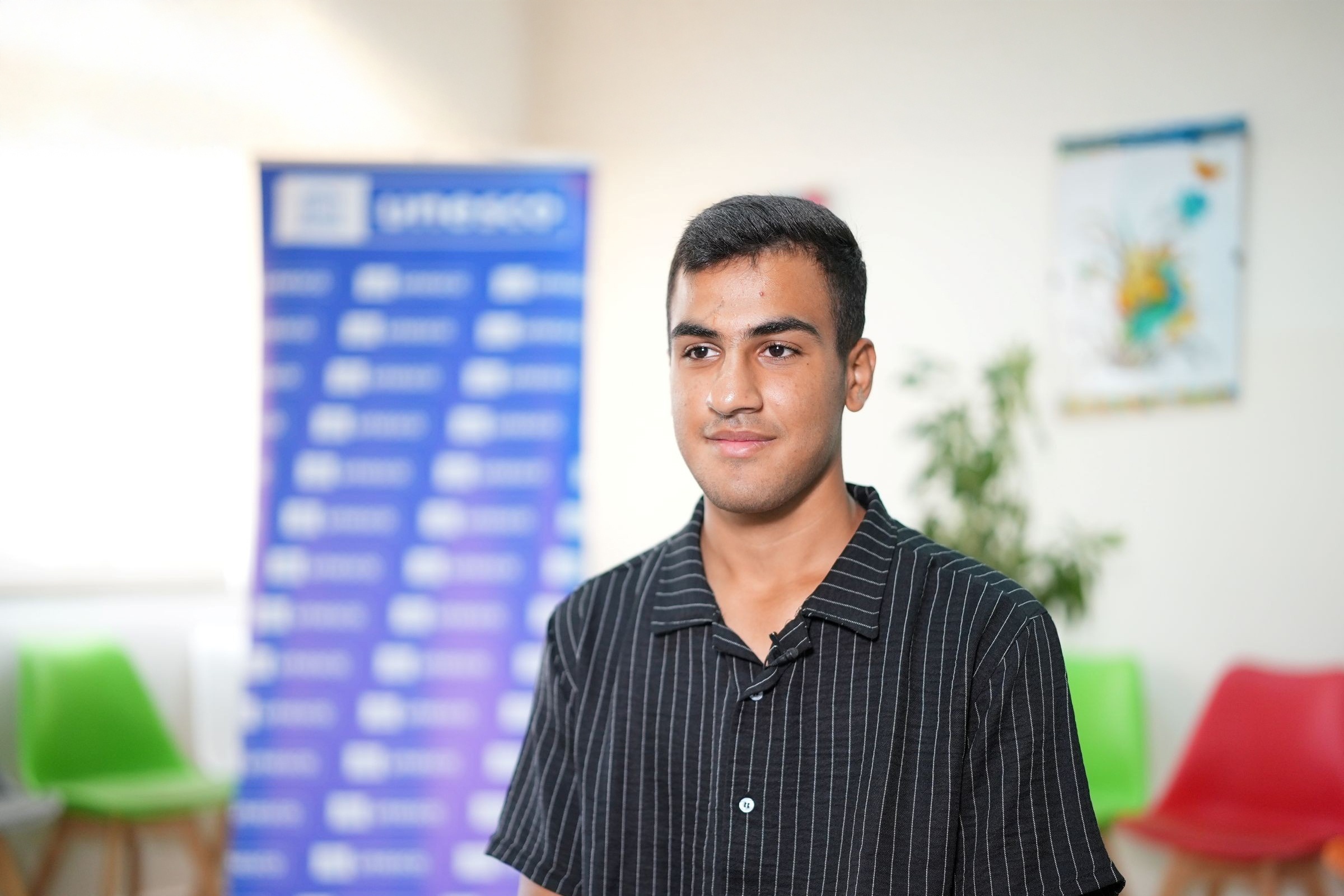 At Omar Al-Zaani School, Qasim cherishes the supportive learning environment and the chance to connect with friends and teachers.